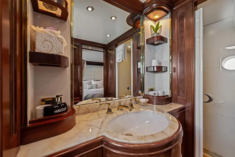Slide: The Image of Luxurious bathroom on 2007 Benetti 120 Classic yacht with marble sink and elegant wood accents. - 120
