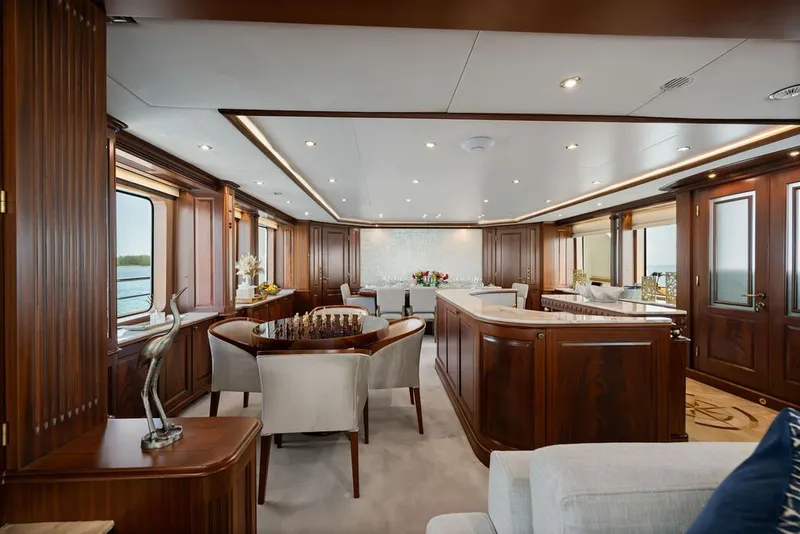Slide: The Image of Luxurious interior of a 2007 Benetti 120 Classic yacht with elegant wood finishes. - 59