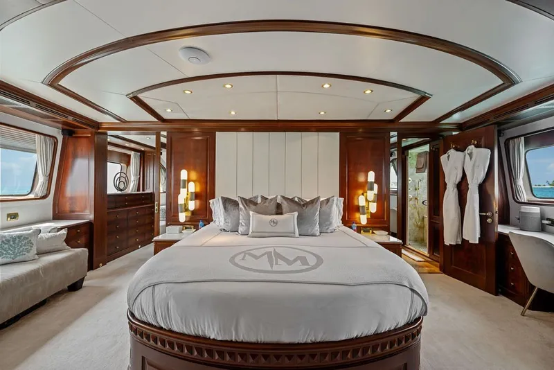 Slide: The Image of Luxurious bedroom interior on a 2007 Benetti 120 Classic yacht, featuring elegant wood finishes. - 98