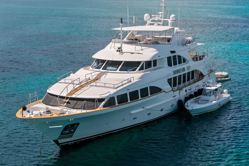 Slide: The Image of Luxury 2007 Benetti 120 Classic yacht anchored in clear blue waters. - 1