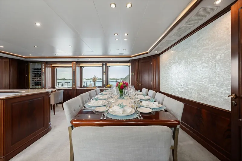 Slide: The Image of Luxurious dining area on a 2007 Benetti 120 Classic yacht, featuring elegant table settings. - 65