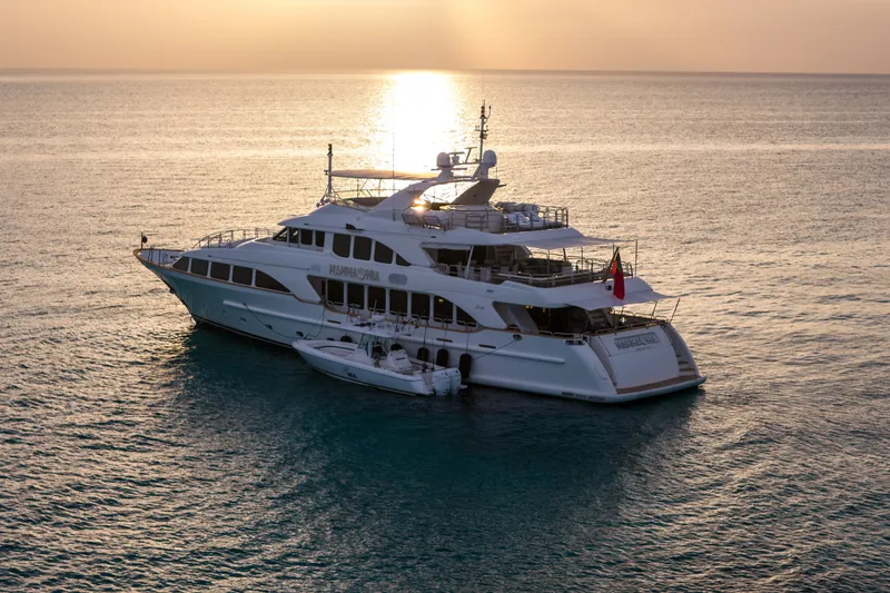 Slide: The Image of Luxury yacht Benetti 120 Classic 2007 at sunset on calm ocean waters. - 14