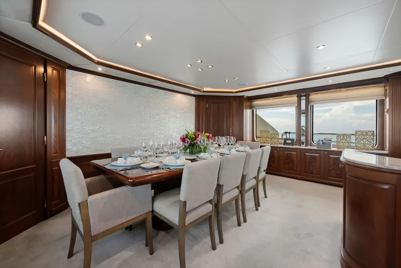 Slide: The Image of Luxurious dining area on a 2007 Benetti 120 Classic yacht, featuring elegant wood finishes. - 72