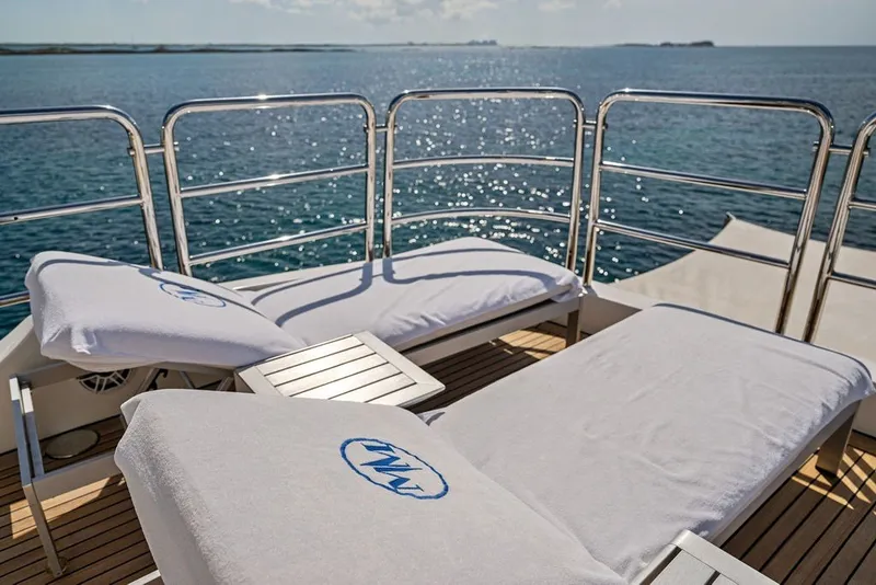 Slide: The Image of Sun loungers on the deck of a 2007 Benetti 120 Classic yacht, overlooking the ocean. - 54