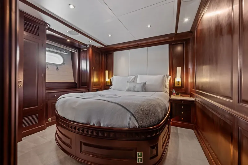 Slide: The Image of Luxurious bedroom interior on 2007 Benetti 120 Classic yacht with elegant wood paneling. - 111