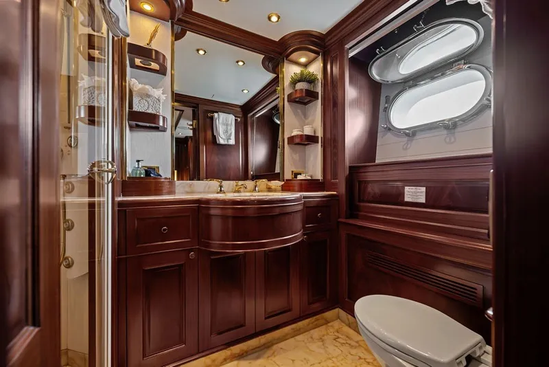Slide: The Image of Luxurious bathroom on a 2007 Benetti 120 Classic yacht with elegant wood finishes. - 114