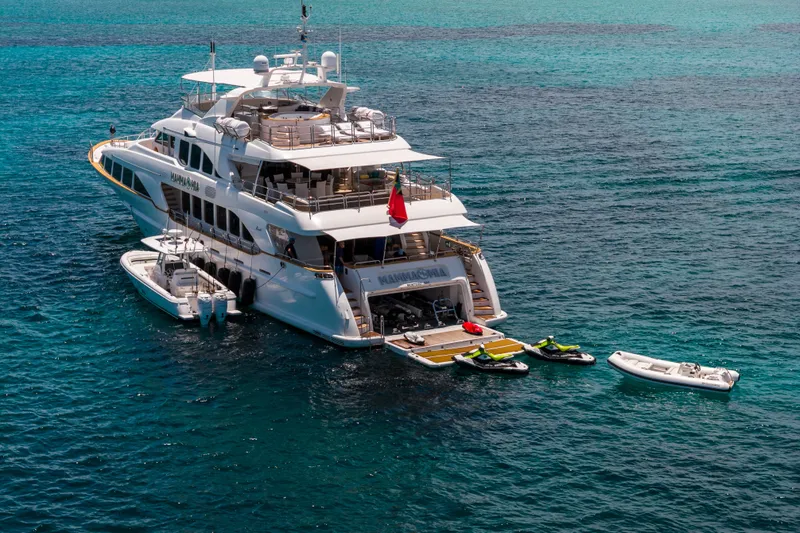 Slide: The Image of Luxurious 2007 Benetti 120 Classic yacht with jet skis and tender in turquoise waters. - 2
