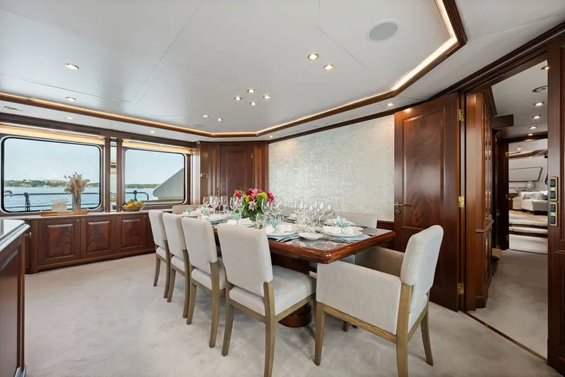 Slide: The Image of Luxurious dining area on a 2007 Benetti 120 Classic yacht, featuring elegant wood finishes. - 66