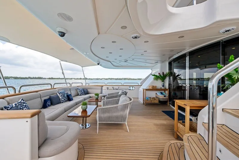 Slide: The Image of Luxurious 2007 Benetti 120 Classic yacht deck with elegant seating and ocean view. - 24