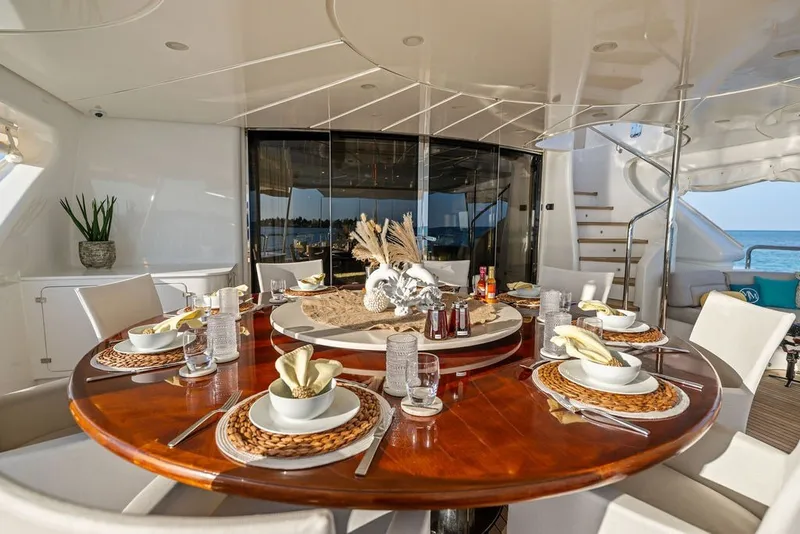 Slide: The Image of Luxurious dining area on a 2007 Benetti 120 Classic yacht, elegantly set for a meal. - 36