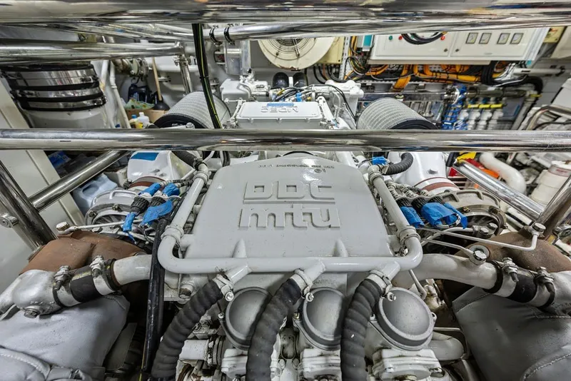 Slide: The Image of Engine room of a 2007 Benetti 120 Classic yacht, showcasing intricate machinery and components. - 154