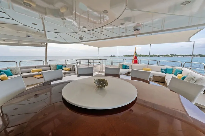 Slide: The Image of Luxurious deck of 2007 Benetti 120 Classic yacht with elegant seating and ocean view. - 29
