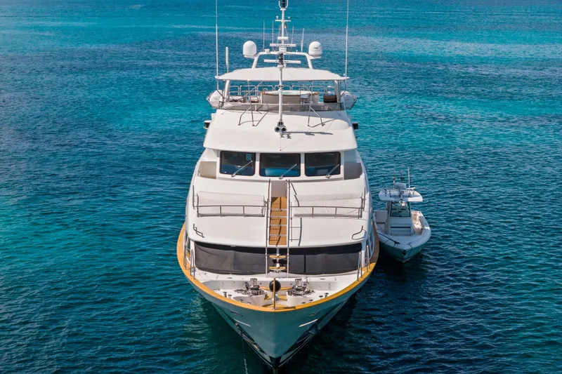 Slide: The Image of Luxury yacht Benetti 120 Classic 2007 on clear blue water, front view. - 10