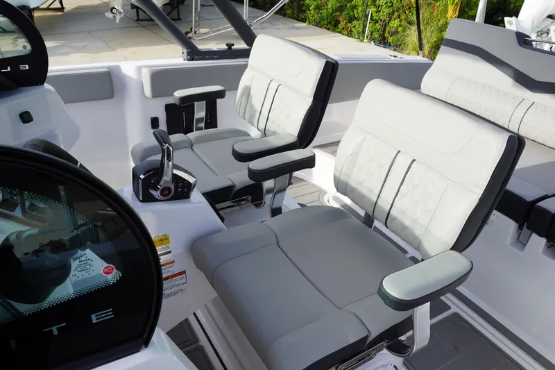 Slide: The Image of 2027 Monterey Elite 23 OB boat interior with modern seating and controls. - 9