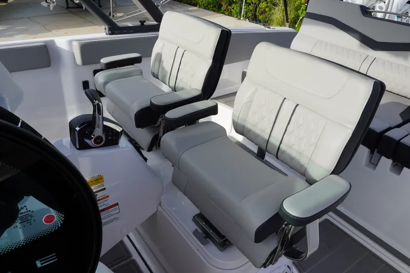 Slide: The Image of Luxury seating in 2027 Monterey Elite 23 OB boat cockpit, featuring modern design and controls. - 8