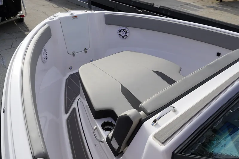 Slide: The Image of 2027 Monterey Elite 23 OB boat interior with cushioned seating and sleek design. - 12