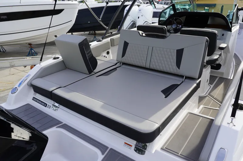 Slide: The Image of 2027 Monterey Elite 23 OB boat interior with sleek seating and modern design. - 4