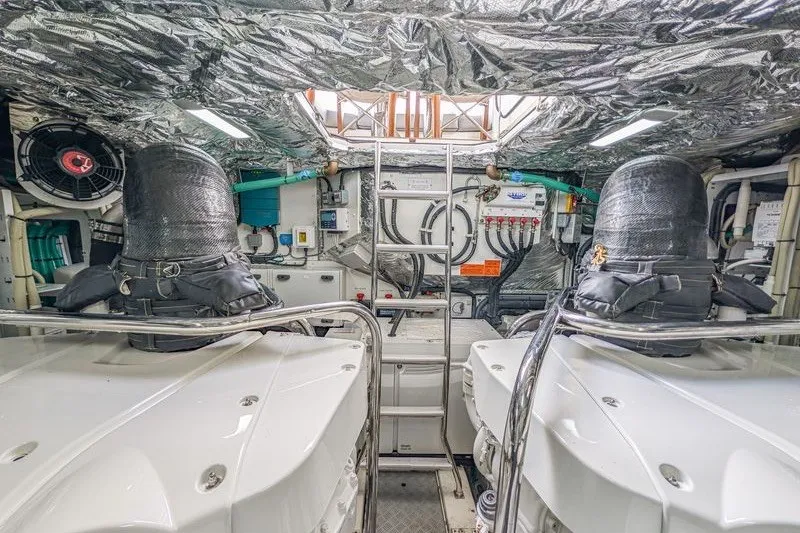 Slide: The Image of Engine room of a 2020 Princess V60 yacht, featuring advanced machinery and equipment. - 26