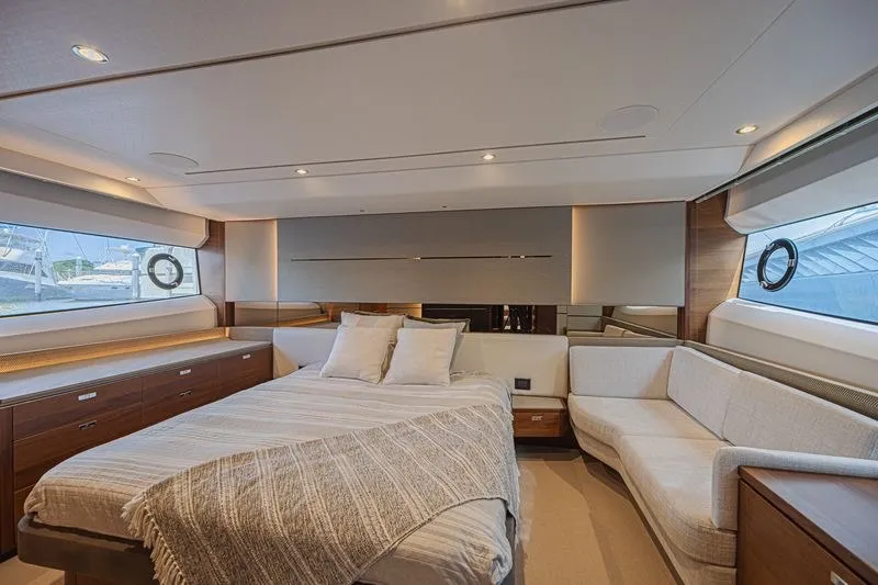Slide: The Image of Luxurious 2020 Princess V60 yacht bedroom with elegant decor and panoramic windows. - 21