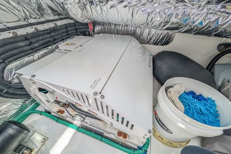 Slide: The Image of Engine room of 2020 Princess V60 yacht with equipment and cleaning supplies. - 24