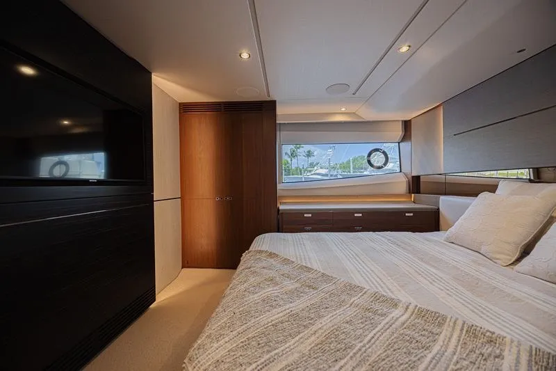 Slide: The Image of Luxurious bedroom interior of 2020 Princess V60 yacht with modern design and large window. - 22