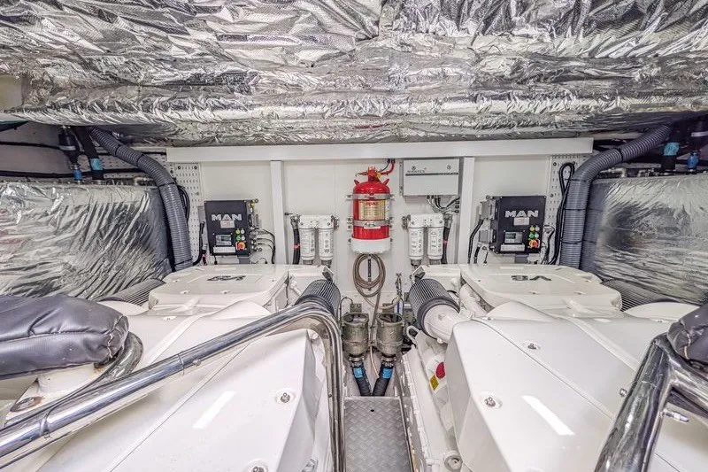 Slide: The Image of Engine room of a 2020 Princess V60 yacht with MAN engines and fire safety equipment. - 25