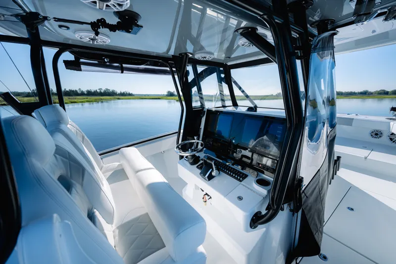 Slide: The Image of Interior of 2023 Freeman 34VH boat with modern navigation system and luxurious seating. - 19