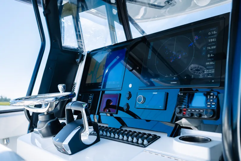 Slide: The Image of Modern helm of 2023 Freeman 34VH boat with advanced navigation technology and controls. - 21