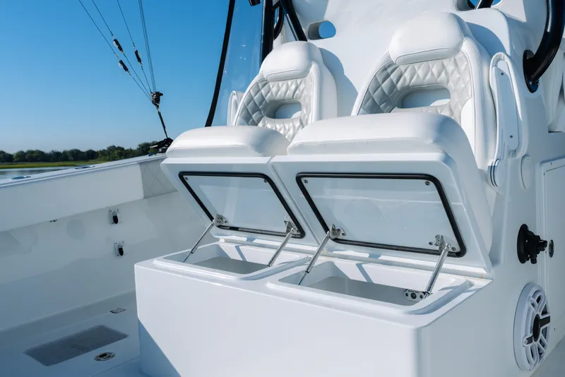 Slide: The Image of Luxury seating and storage on 2023 Freeman 34VH boat, featuring sleek white design. - 29