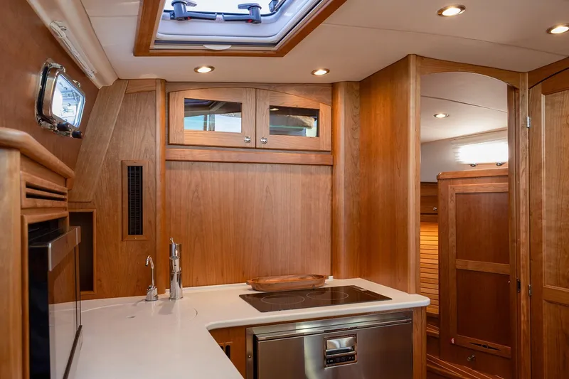 Slide: The Image of Manufacturer Provided Image: Luxurious interior of 2027 Sabre 38 Salon Express yacht with modern kitchen amenities. - 14