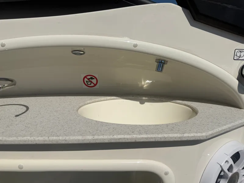 Slide: The Image of Close-up of a sink on a boat with a gray countertop. - 21