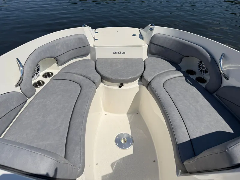 Slide: The Image of The image shows the bow area of a Stingray 214 LR boat with gray upholstery. - 10