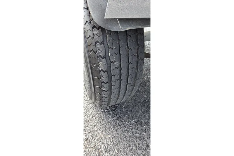 Slide: The Image of Close-up of a 2021 Ranger VS1882 WT tire on asphalt surface. - 38