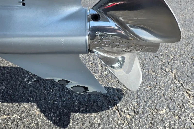 Slide: The Image of Close-up of a 2021 Ranger VS1882 WT boat propeller on asphalt surface. - 29