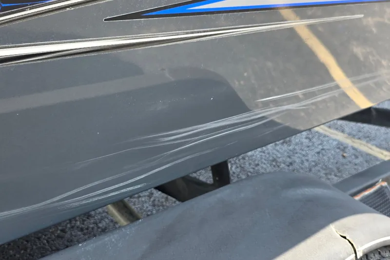 Slide: The Image of 2021 Ranger VS1882 WT boat with visible scratches on the hull. - 33