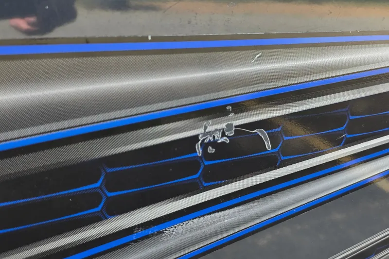 Slide: The Image of Close-up of 2021 Ranger VS1882 WT boat detailing with blue and black accents. - 28