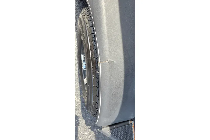 Slide: The Image of 2021 Ranger VS1882 WT tire with visible sidewall damage. - 24