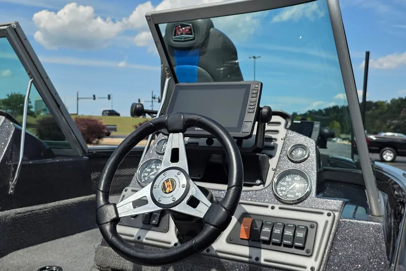 Slide: The Image of 2021 Ranger VS1882 WT boat dashboard with steering wheel and navigation display. - 14