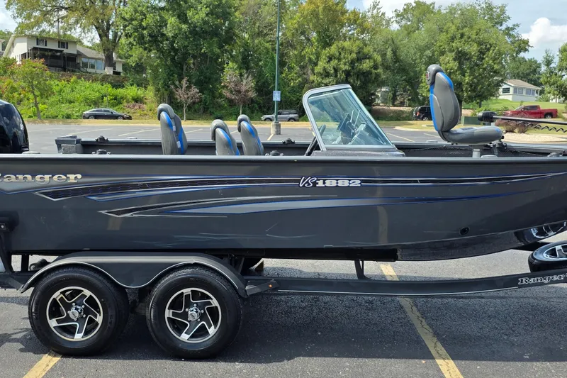 Slide: The Image of 2021 Ranger VS1882 WT fishing boat on trailer in parking lot. - 1