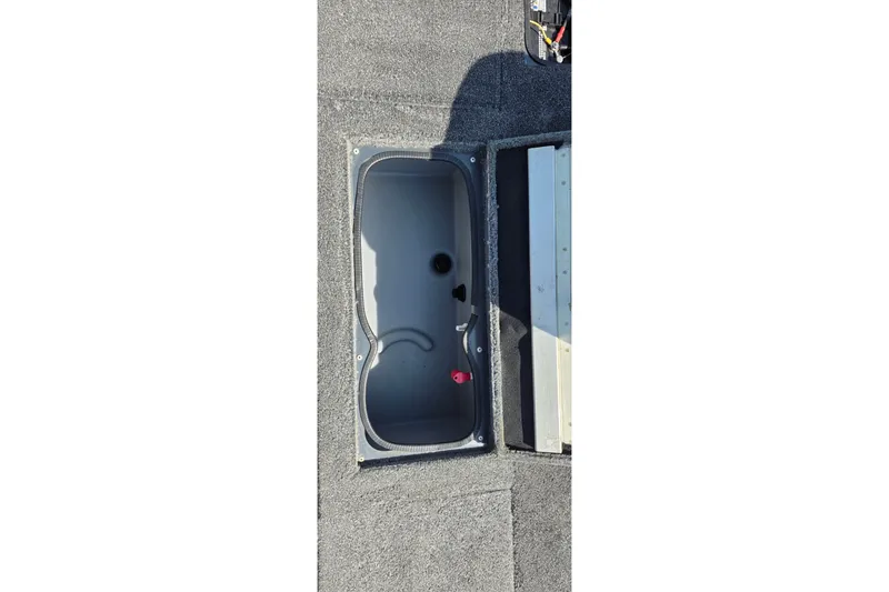 Slide: The Image of 2021 Ranger VS1882 WT boat storage compartment with open lid, showing interior details. - 41