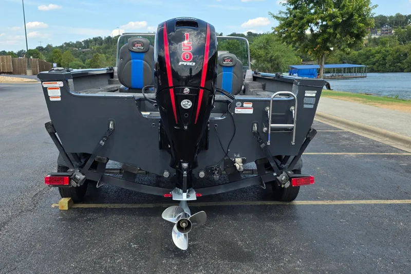 Slide: The Image of 2021 Ranger VS1882 WT boat with 150 HP engine, parked near a lake. - 29