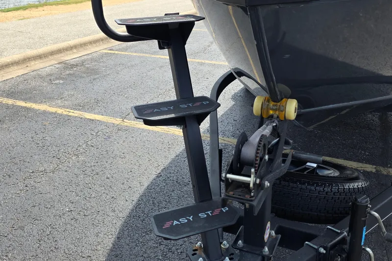 Slide: The Image of 2021 Ranger VS1882 WT boat trailer with Easy Step system in a parking lot. - 8