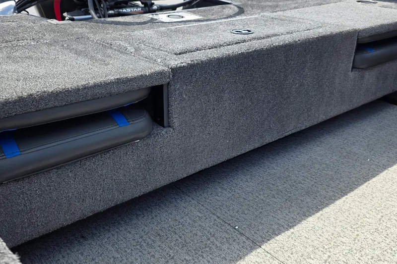 Slide: The Image of 2021 Ranger VS1882 WT boat interior with gray carpeted storage compartments. - 16