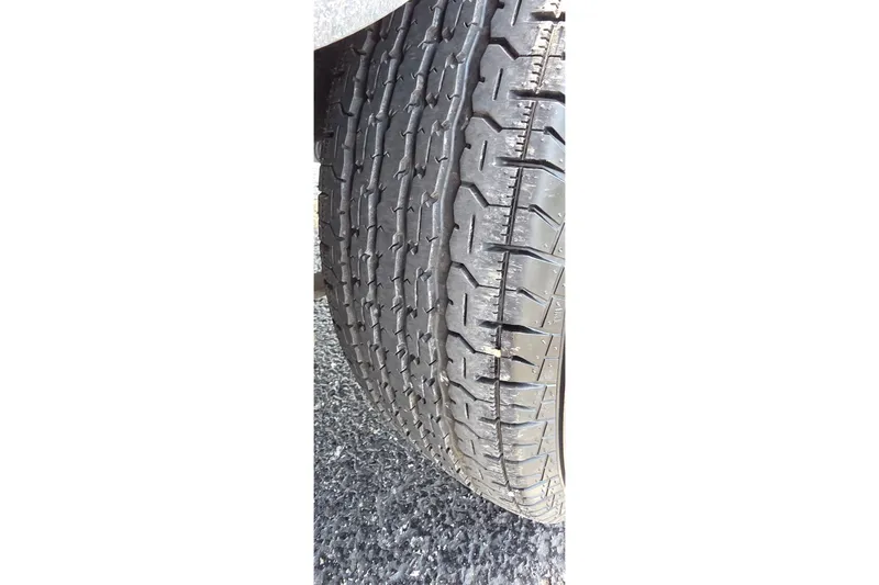 Slide: The Image of Close-up of a 2021 Ranger VS1882 WT tire on asphalt surface. - 27