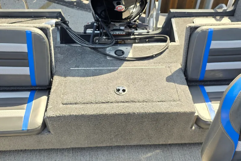 Slide: The Image of 2021 Ranger VS1882 WT boat interior with gray and blue seating. - 38