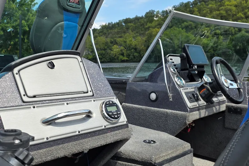 Slide: The Image of 2021 Ranger VS1882 WT boat interior with steering wheel and control panel. - 21