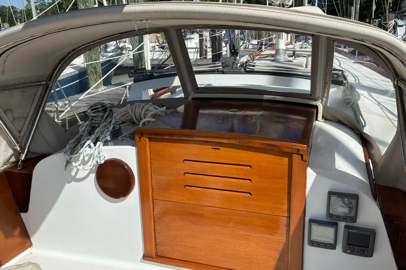 Slide: The Image of Hinckley Bermuda 40 MKIII sailboat cockpit with wooden hatch and navigation instruments, 1966 model. - 15