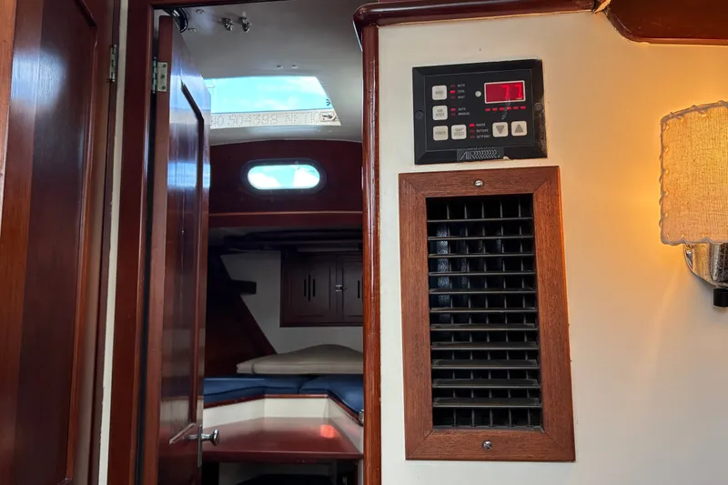 Slide: The Image of Interior of 1966 Hinckley Bermuda 40 MKIII sailboat with wood paneling and cabin view. - 35