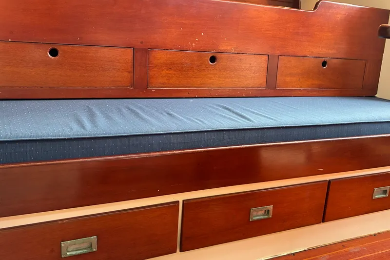 Slide: The Image of Wooden interior seating with blue cushion on 1966 Hinckley Bermuda 40 MKIII sailboat. - 40