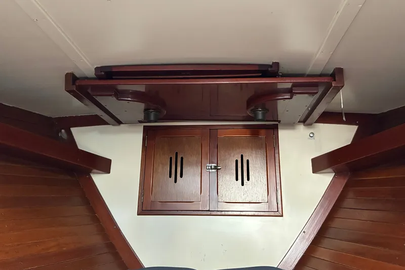 Slide: The Image of Interior of 1966 Hinckley Bermuda 40 MKIII sailboat with wooden cabinetry and ceiling details. - 49